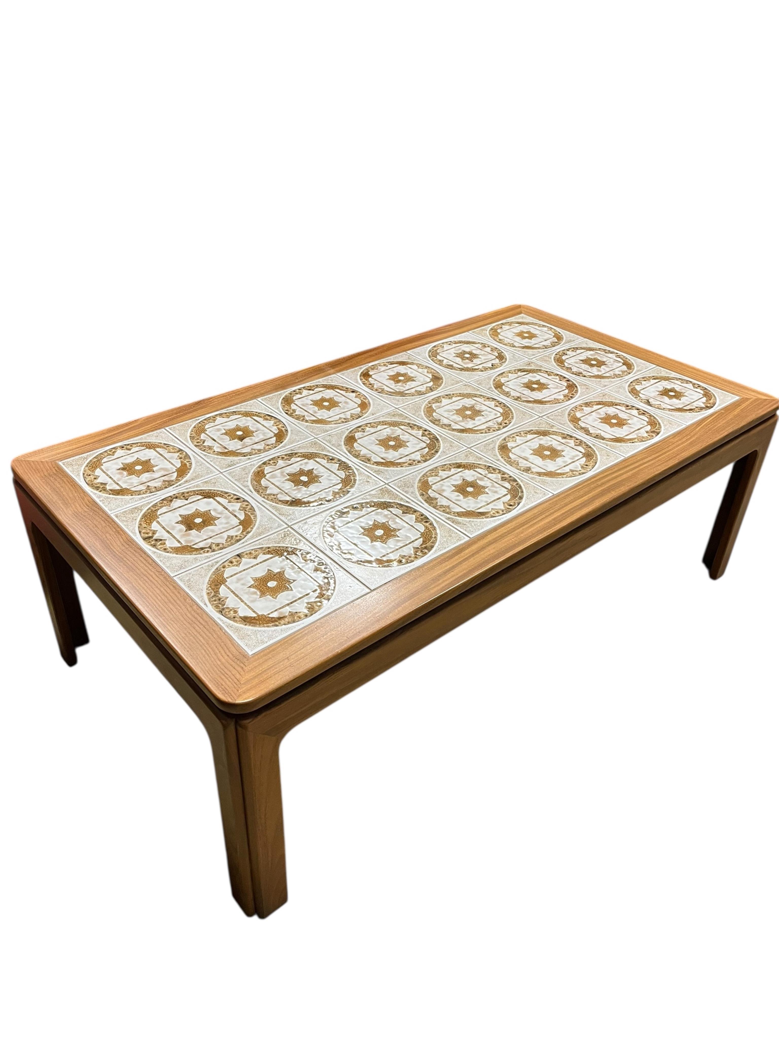 A mid century G Plan tile top teak coffee table and two matching occasional tables, larger width 134cm, depth 74cm, height 46cm